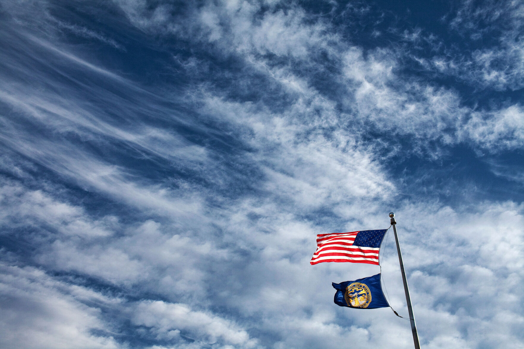 US, Nebraska flags outside Lincoln Southwest, 2010